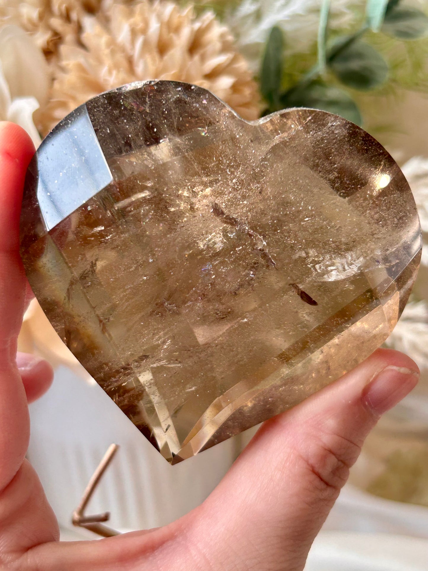 Faceted Smoky Quartz heart with natural smoky tones and custom crystal display stand.