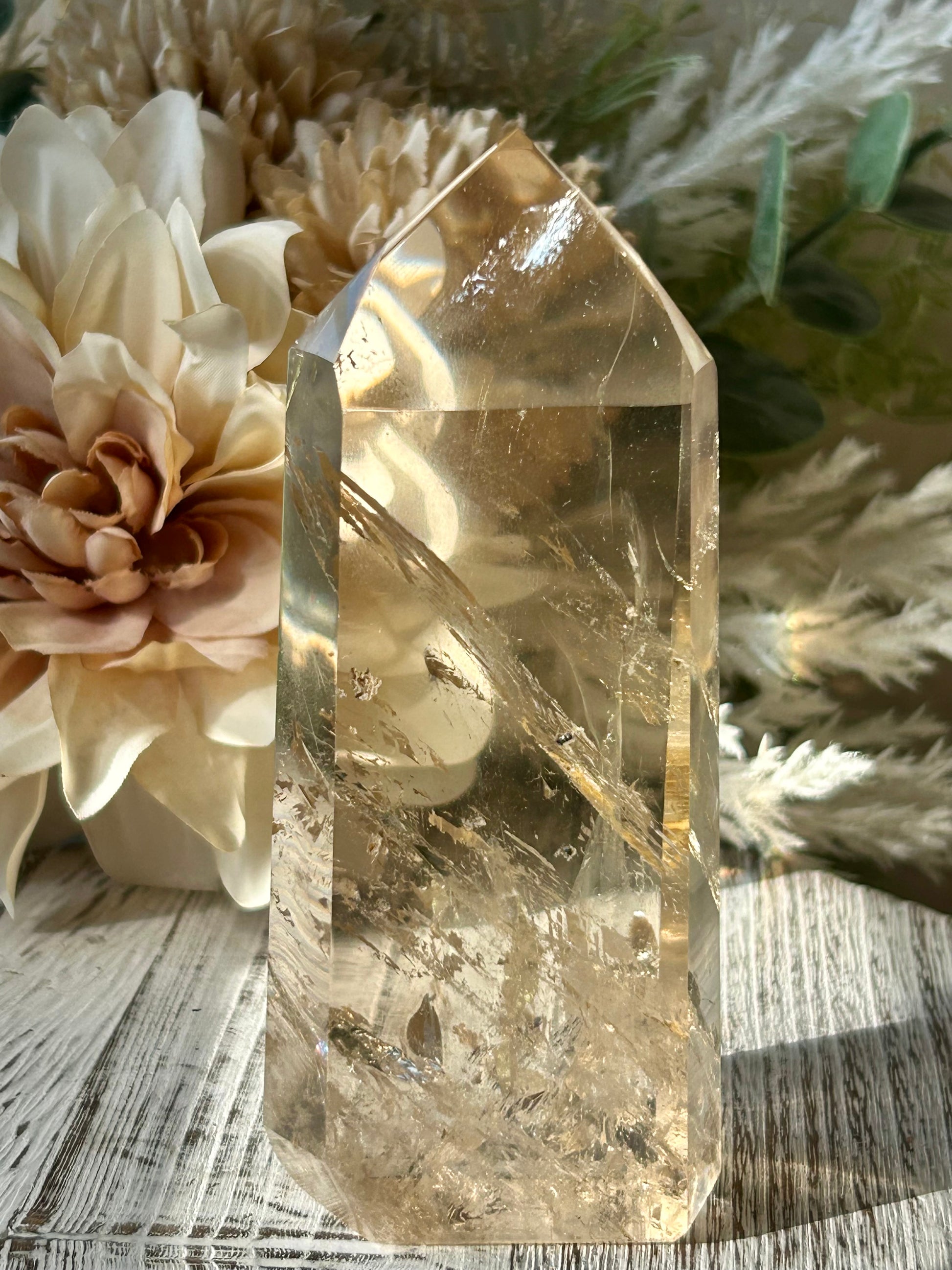 Polished Citrine tower displaying warm honey-gold tones, natural crystal inclusions, and beautiful clarity.
