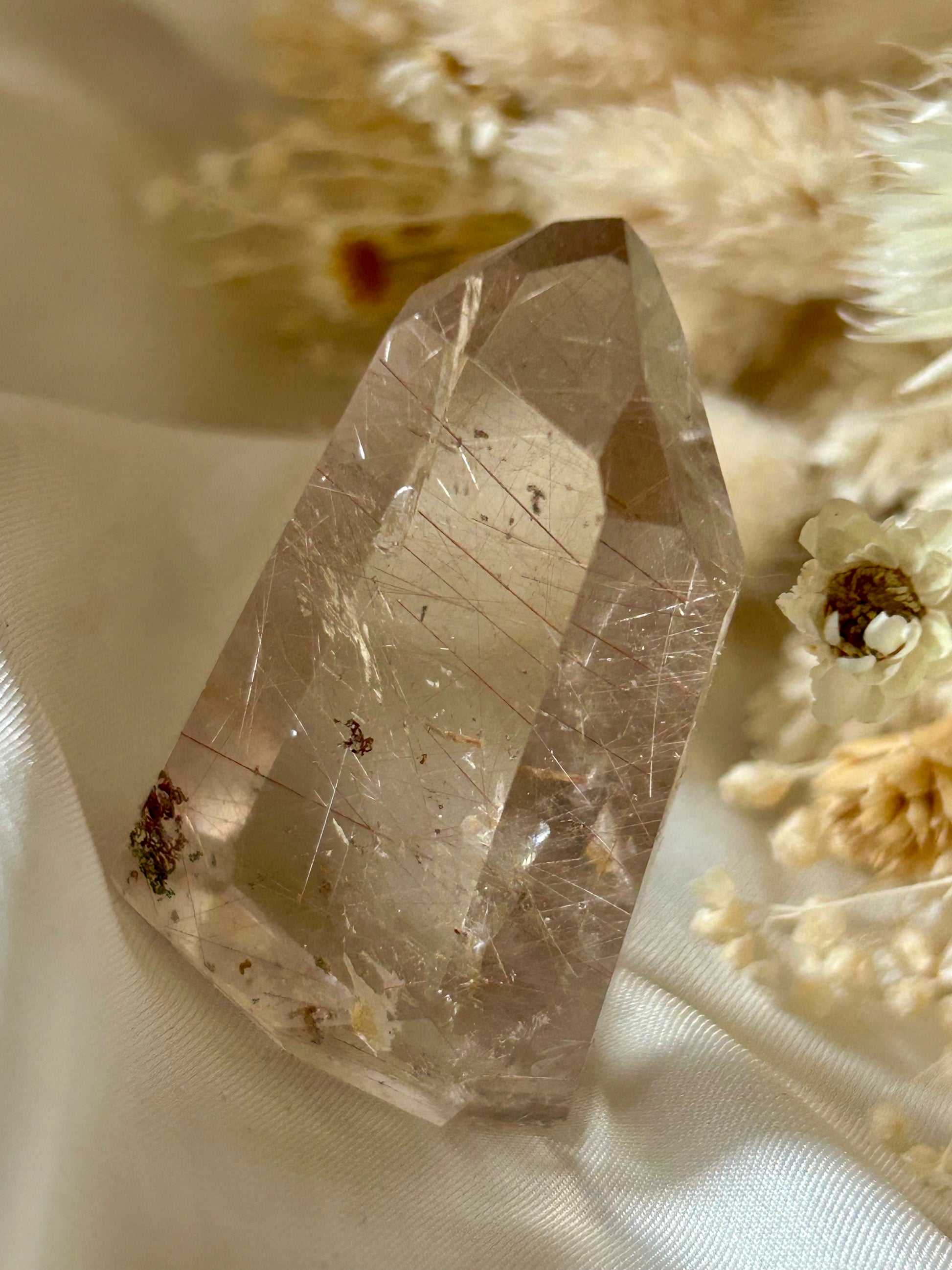 Brazilian AAA rutile quartz crystal showing clarity and radiance in natural lighting