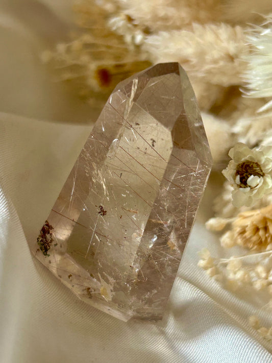 Brazilian AAA rutile quartz crystal showing clarity and radiance in natural lighting
