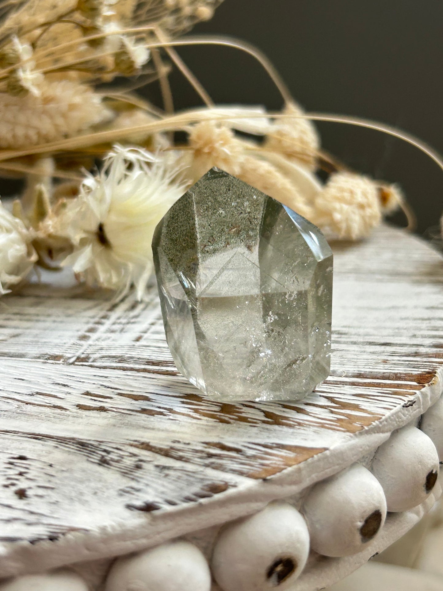 Chlorite phantom quartz point showing green chlorite inclusions and layered phantom growth within clear quartz.