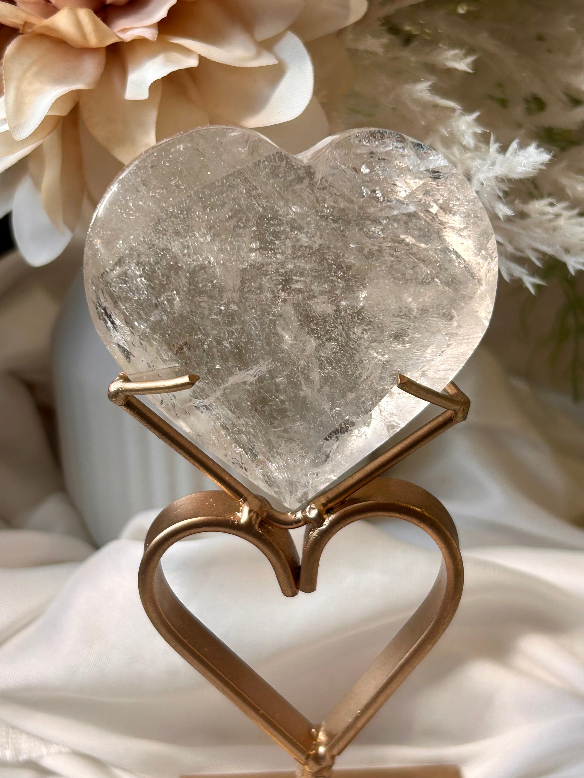 Faceted Smoky Quartz heart with natural smoky tones and custom crystal display stand.