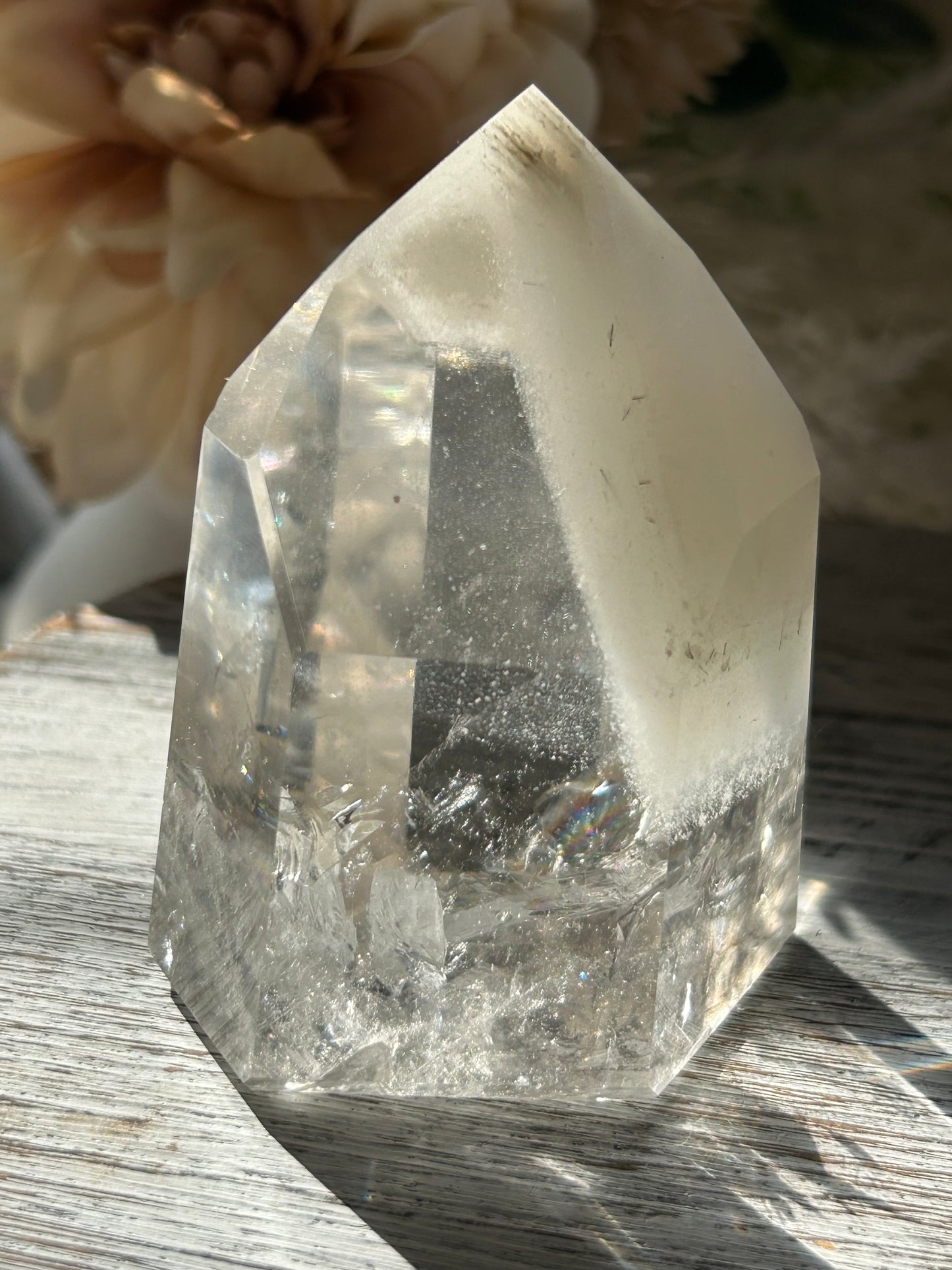 Polished Phantom Quartz tower with layered ghost-like inclusions and natural internal formations