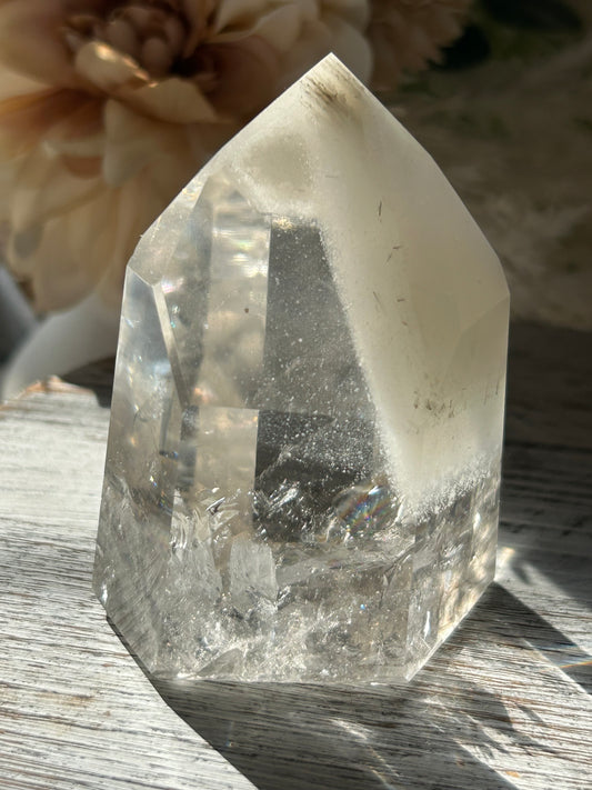 Polished Phantom Quartz tower with layered ghost-like inclusions and natural internal formations