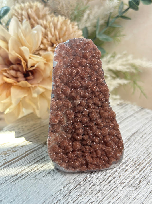 Pink Rainbow Amethyst druzy cut base with sparkling rounded crystal formations and warm blush tones.