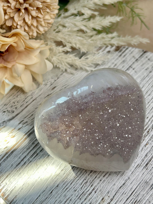 Rainbow Amethyst heart with sparkling lavender druzy, polished quartz, and soft pastel crystal tones.