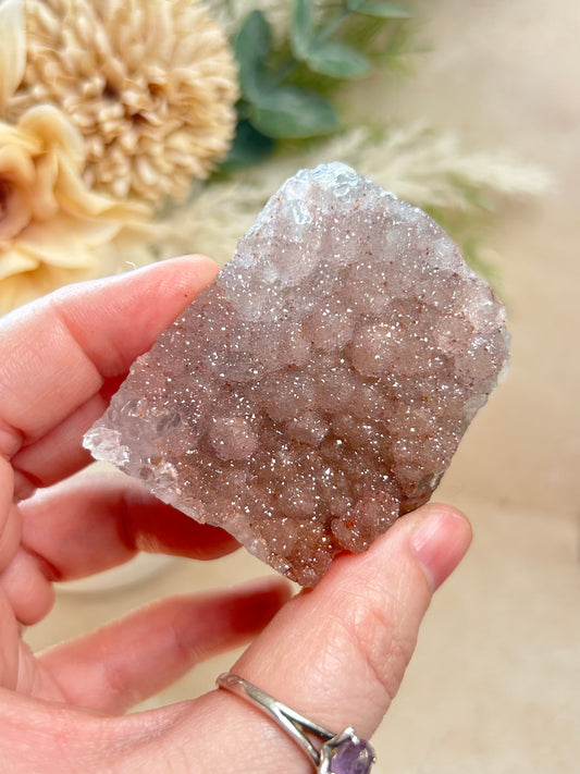 Pale pink sugar druzy Rainbow Amethyst cluster with sparkling crystal texture and soft blush tones.