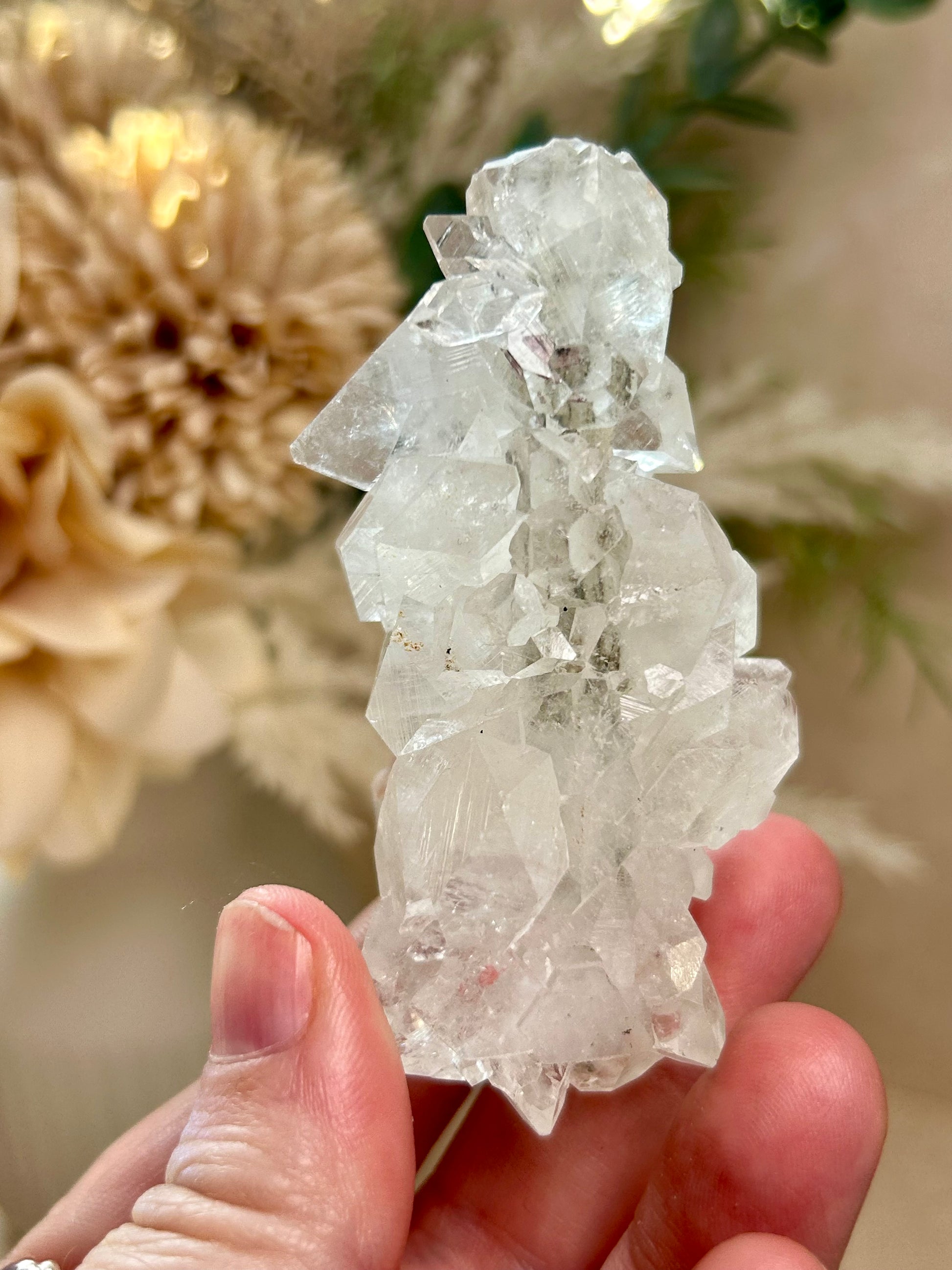 Natural Apophyllite stalactite with sparkling crystal texture and layered mineral formation.