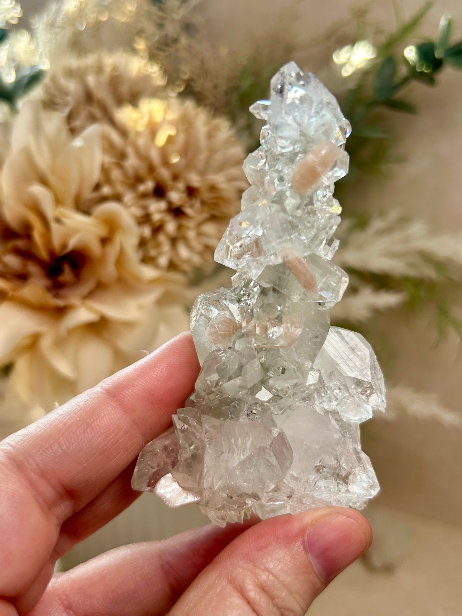 Natural Apophyllite stalactite with sparkling crystal texture and layered mineral formation.