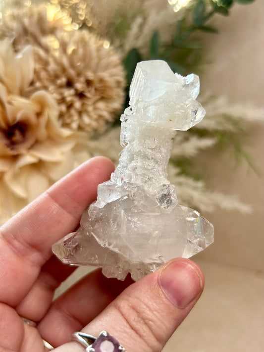 Natural Apophyllite stalactite with sparkling crystal texture and layered mineral formation.
