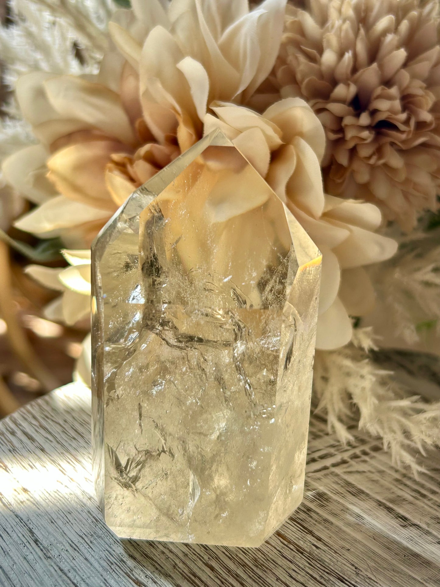 Champagne Citrine polished point with soft golden clarity, natural internal texture, and warm translucent tones.