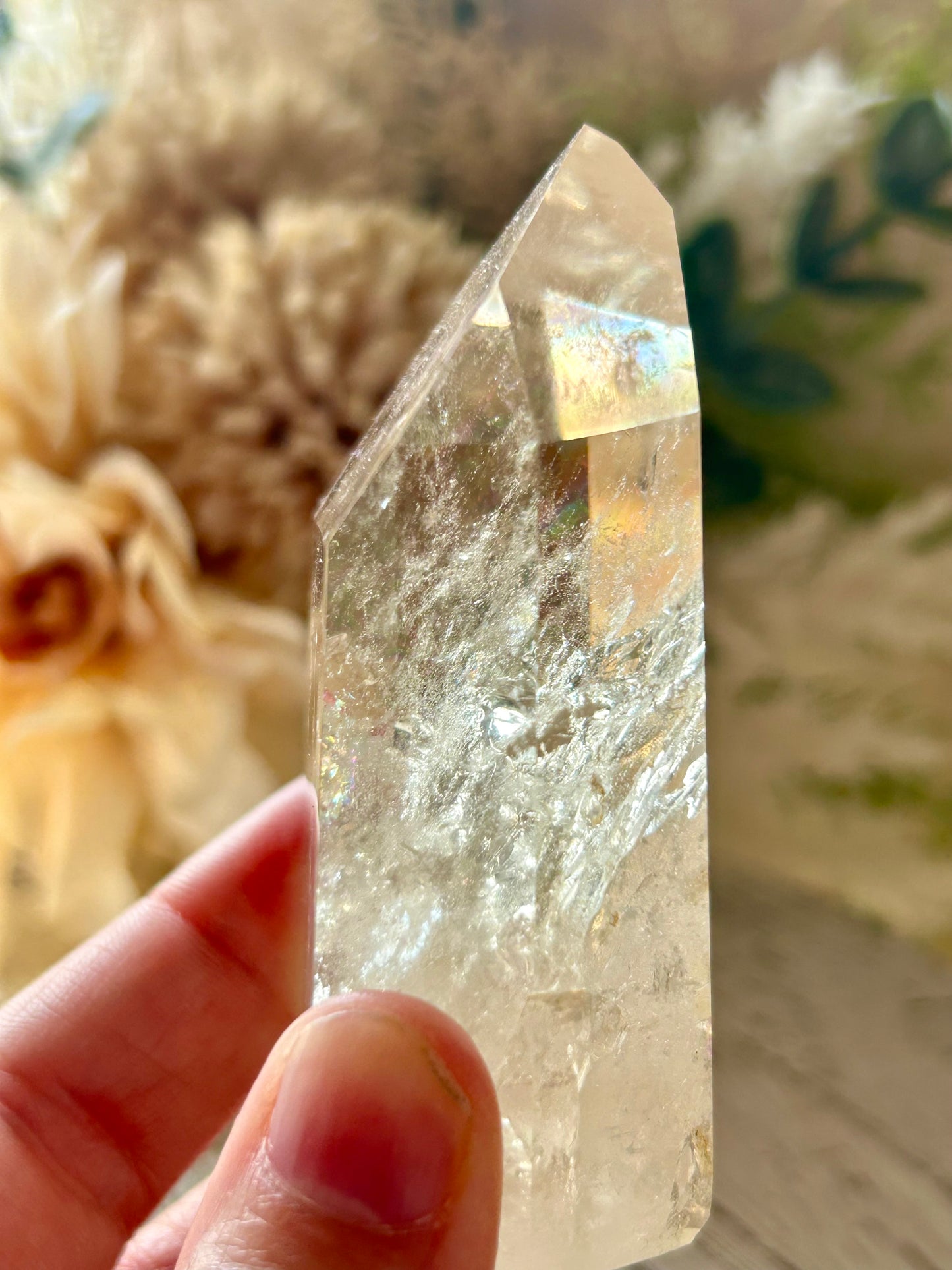 Champagne Citrine polished point with soft golden clarity, natural internal texture, and warm translucent tones.