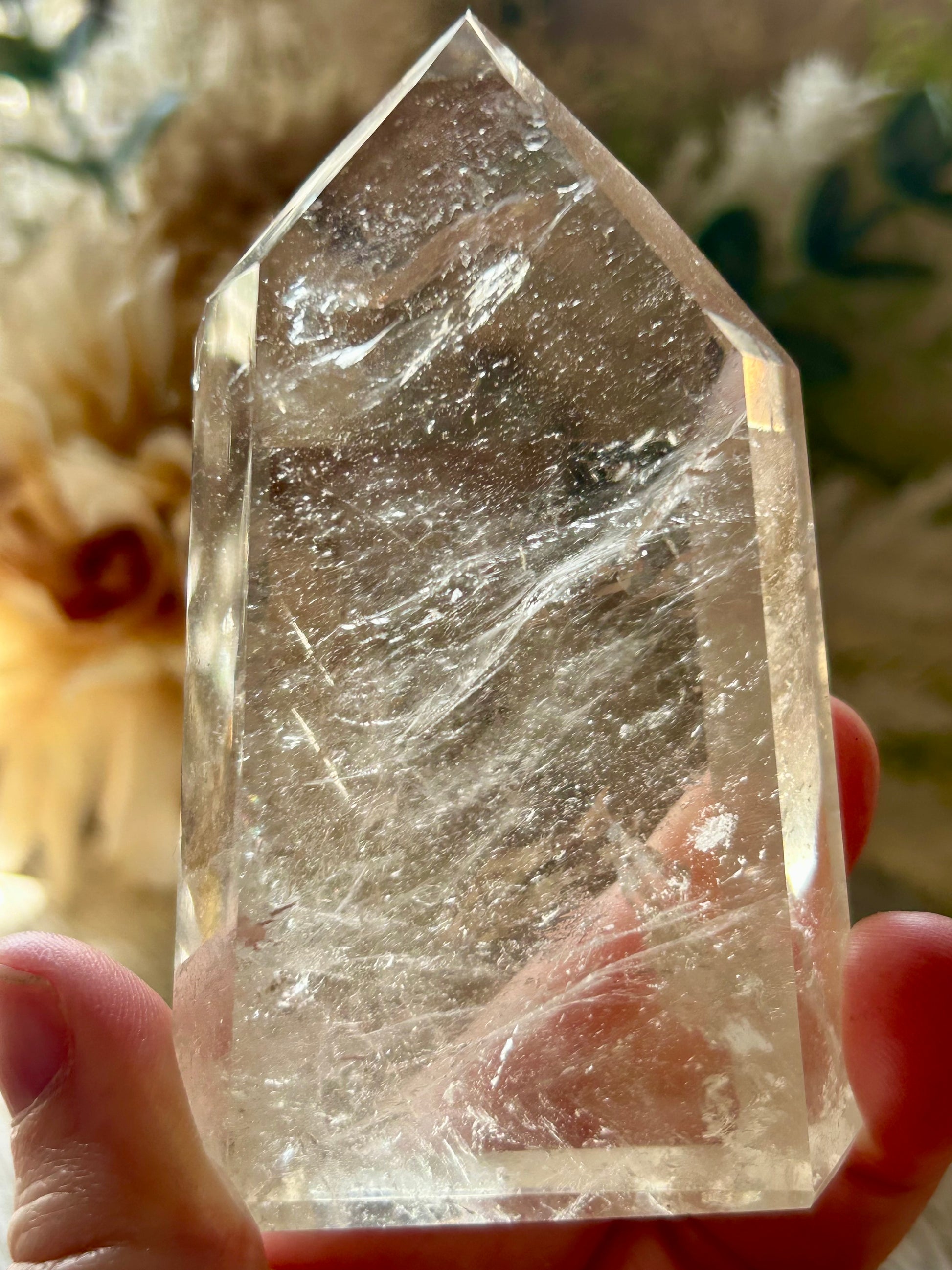 Champagne Citrine polished point with soft golden clarity, natural internal texture, and warm translucent tones.