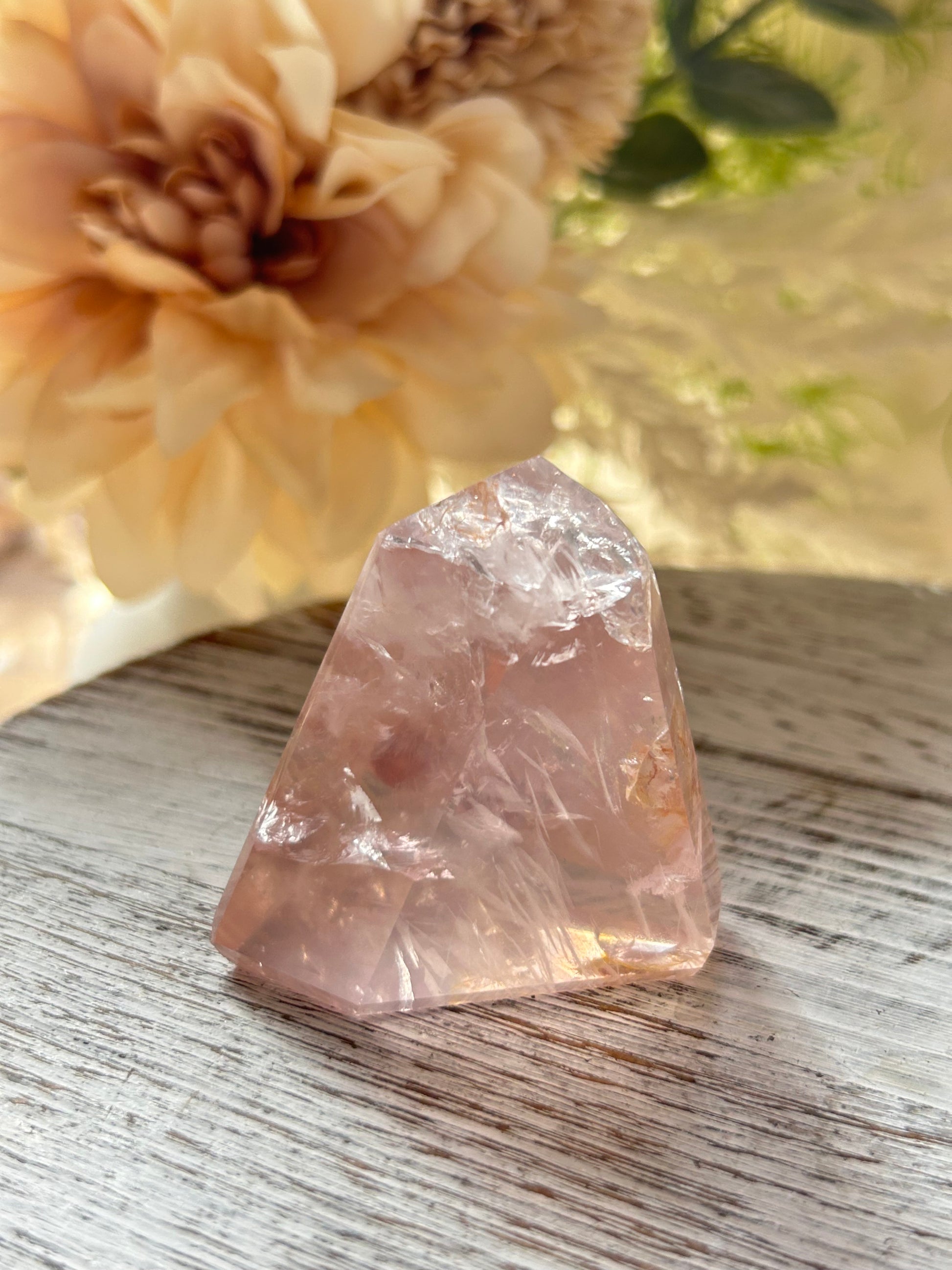 Beautiful polished Rose Quartz with calming blush tones, natural clarity, and glossy crystal finish.