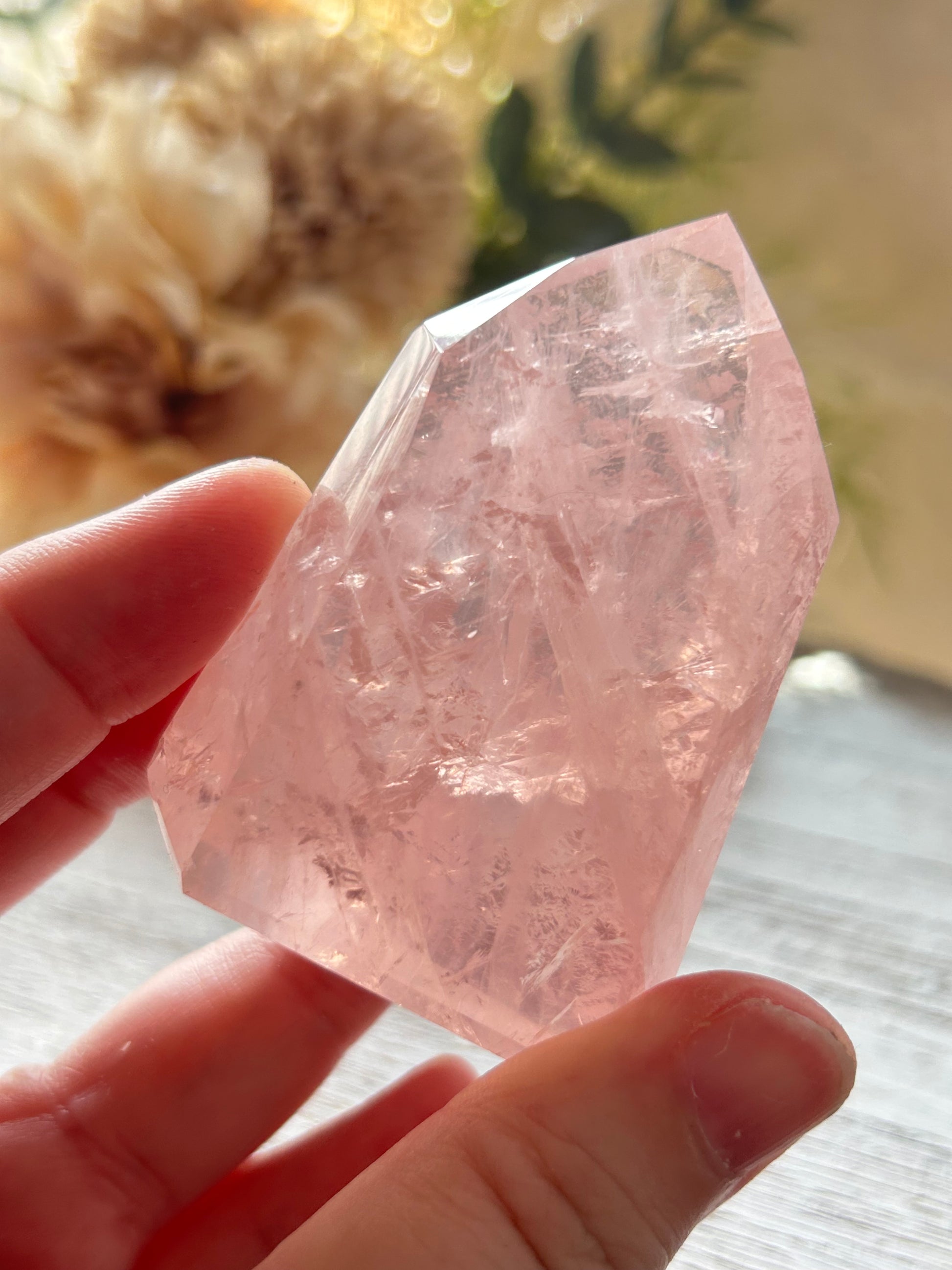 Beautiful polished Rose Quartz with calming blush tones, natural clarity, and glossy crystal finish.