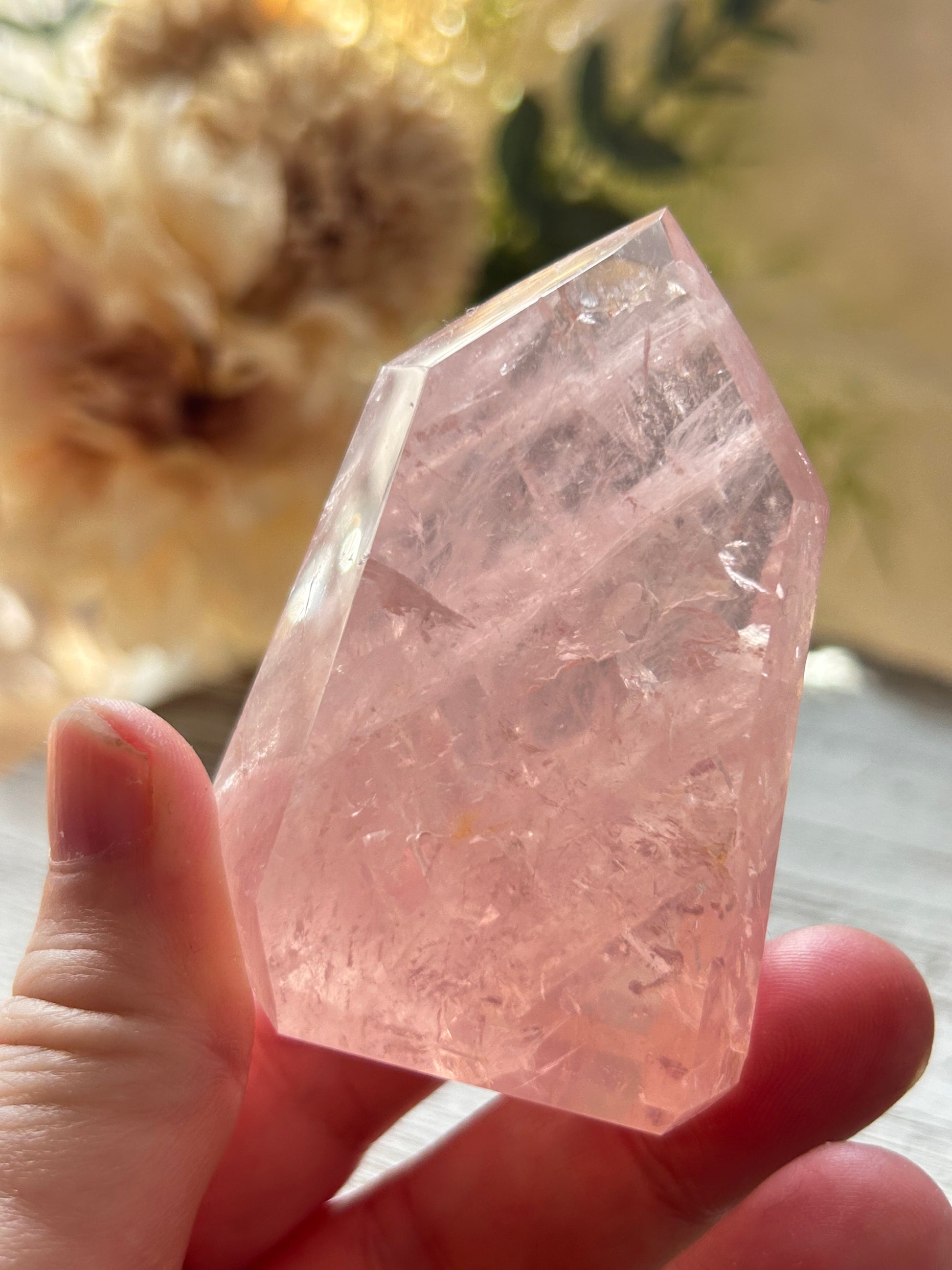 Beautiful polished Rose Quartz with calming blush tones, natural clarity, and glossy crystal finish.