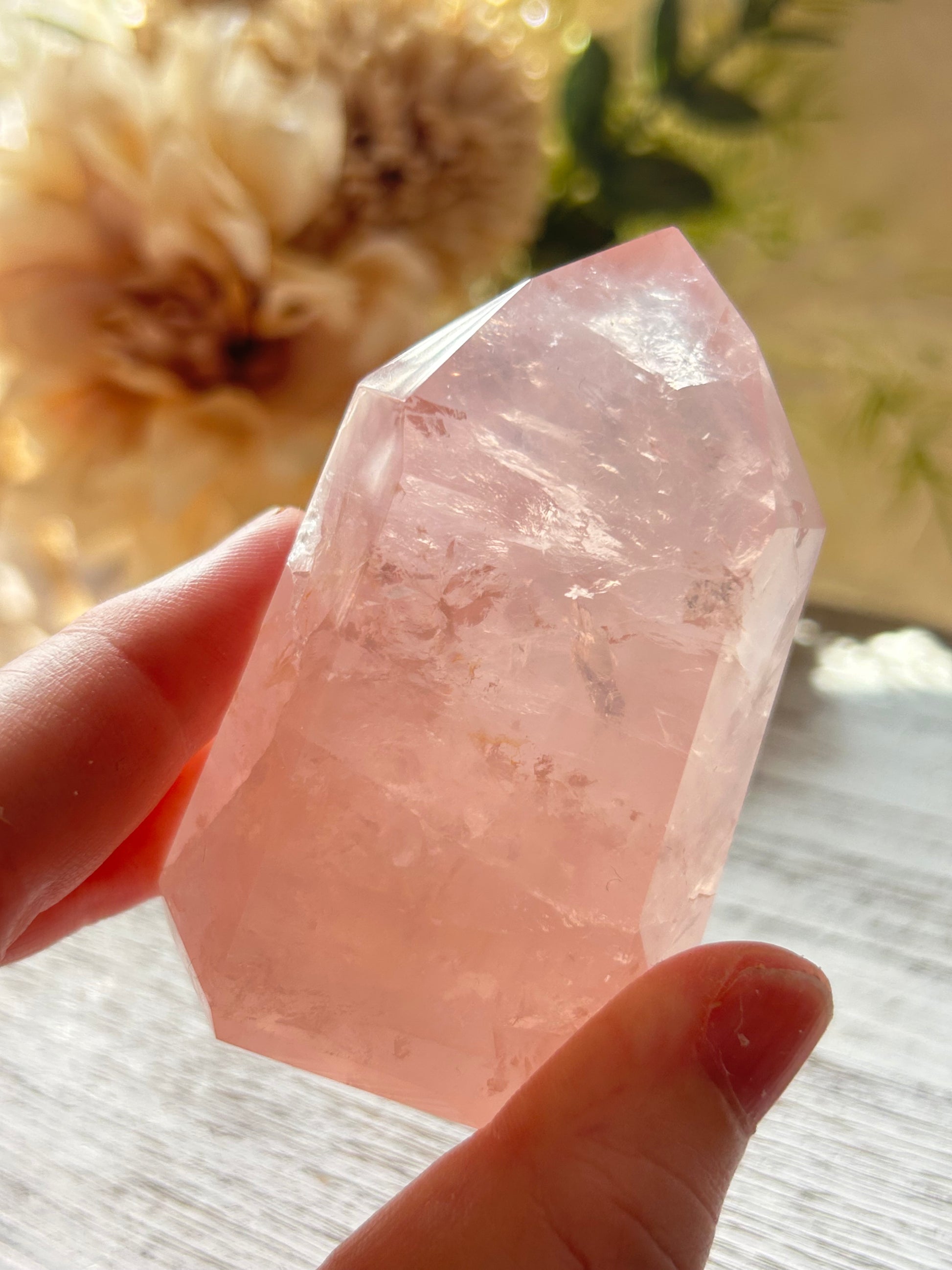 Beautiful polished Rose Quartz with calming blush tones, natural clarity, and glossy crystal finish.