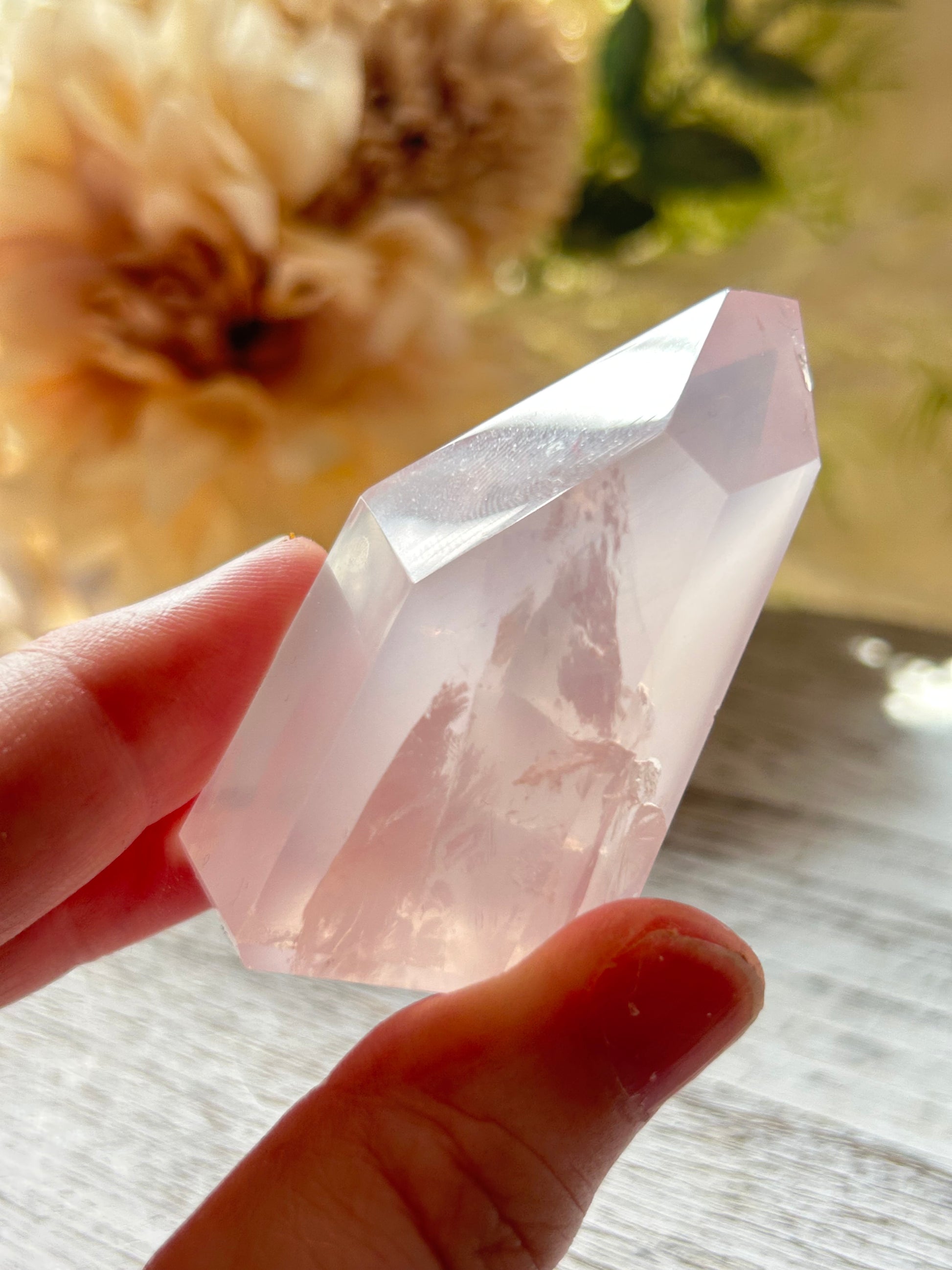 Beautiful polished Rose Quartz with calming blush tones, natural clarity, and glossy crystal finish.