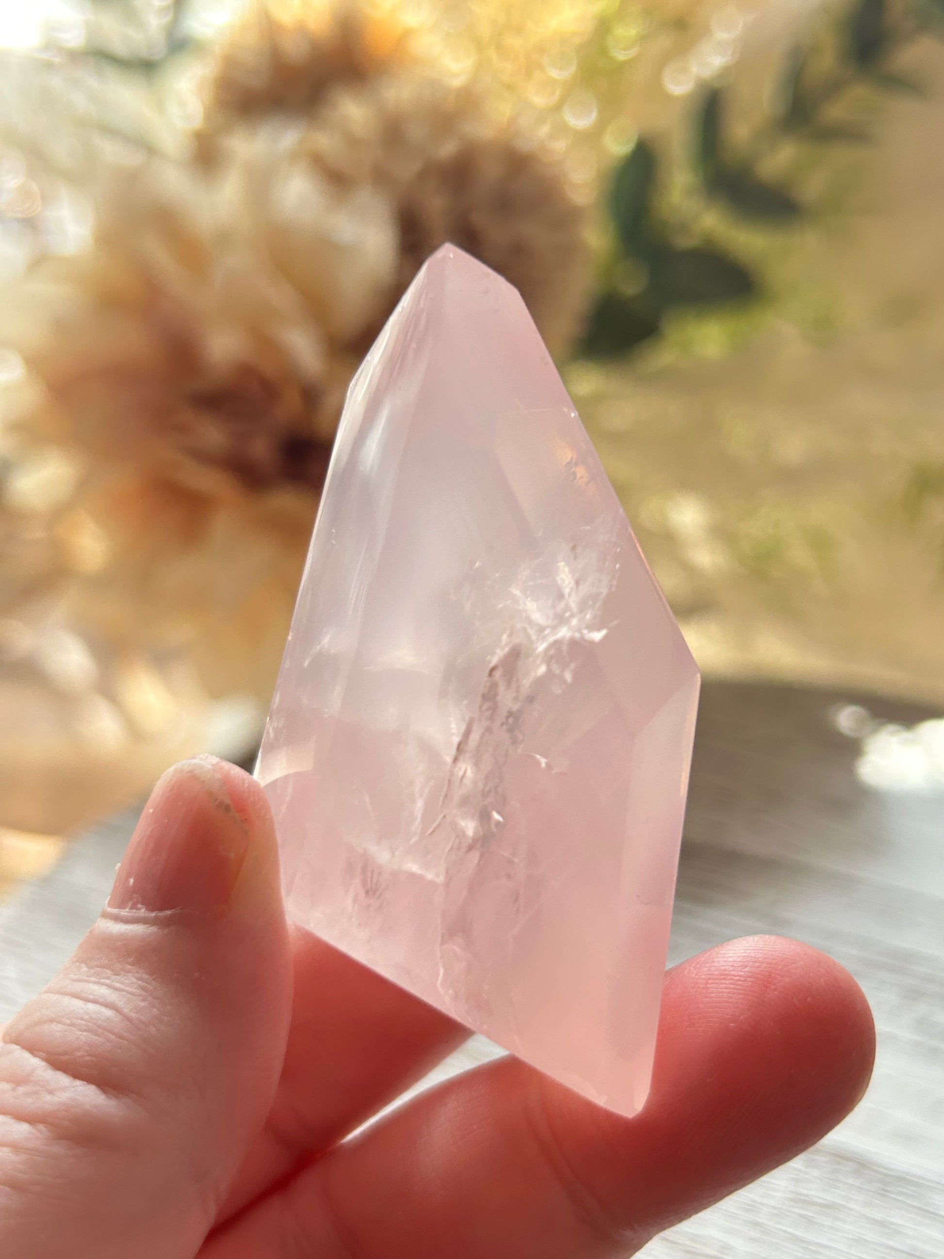 Beautiful polished Rose Quartz with calming blush tones, natural clarity, and glossy crystal finish.