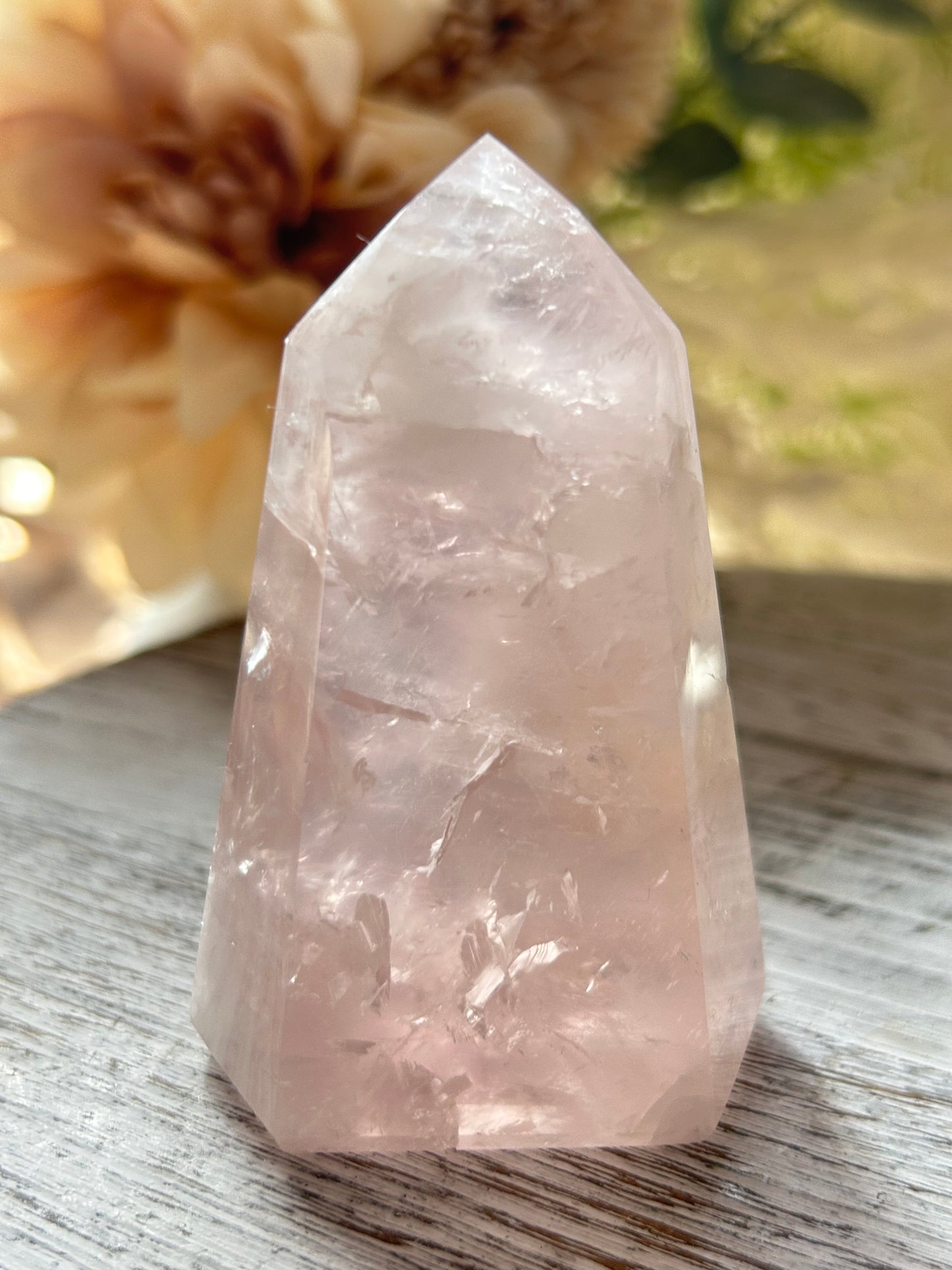 Beautiful polished Rose Quartz with calming blush tones, natural clarity, and glossy crystal finish.
