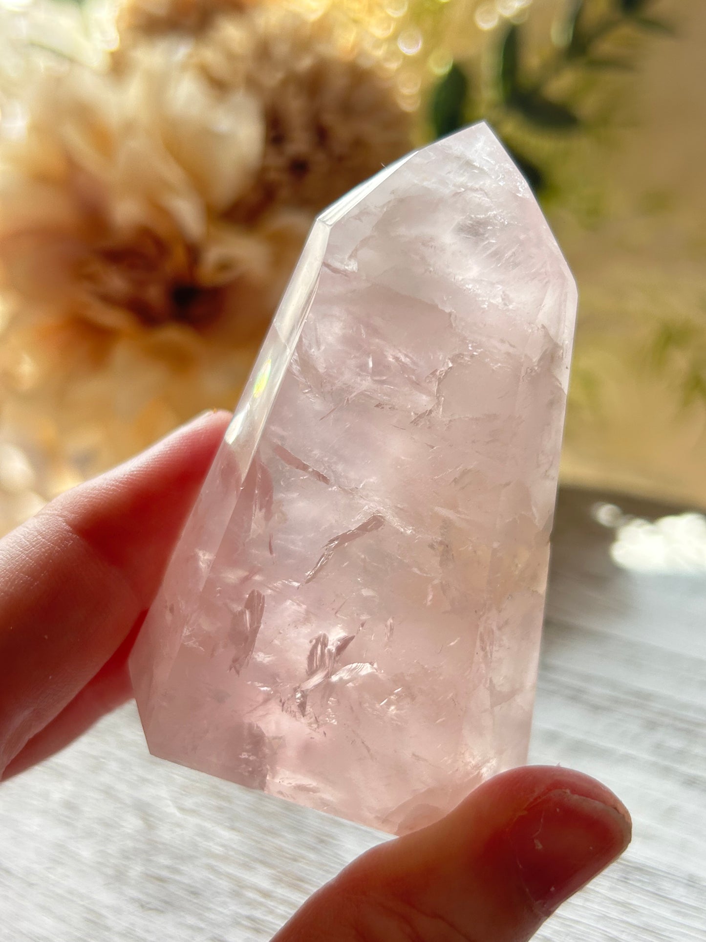 Beautiful polished Rose Quartz with calming blush tones, natural clarity, and glossy crystal finish.