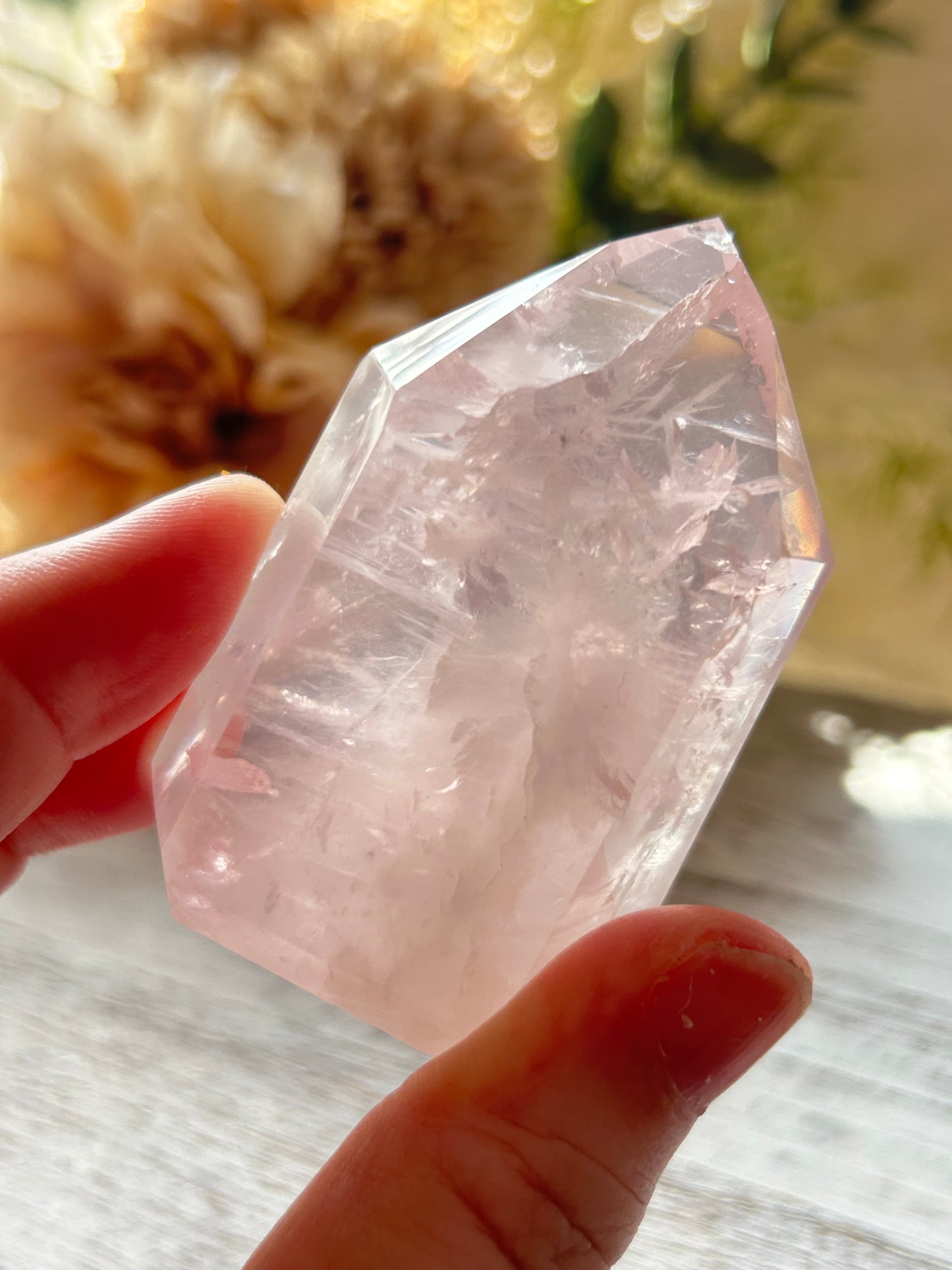 Beautiful polished Rose Quartz with calming blush tones, natural clarity, and glossy crystal finish.
