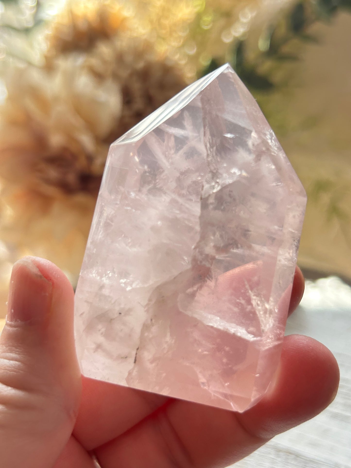 Beautiful polished Rose Quartz with calming blush tones, natural clarity, and glossy crystal finish.