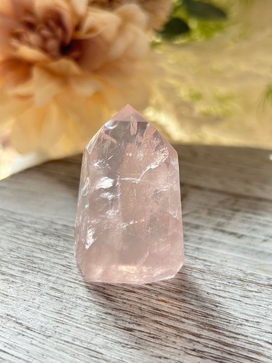 Beautiful polished Rose Quartz with calming blush tones, natural clarity, and glossy crystal finish.