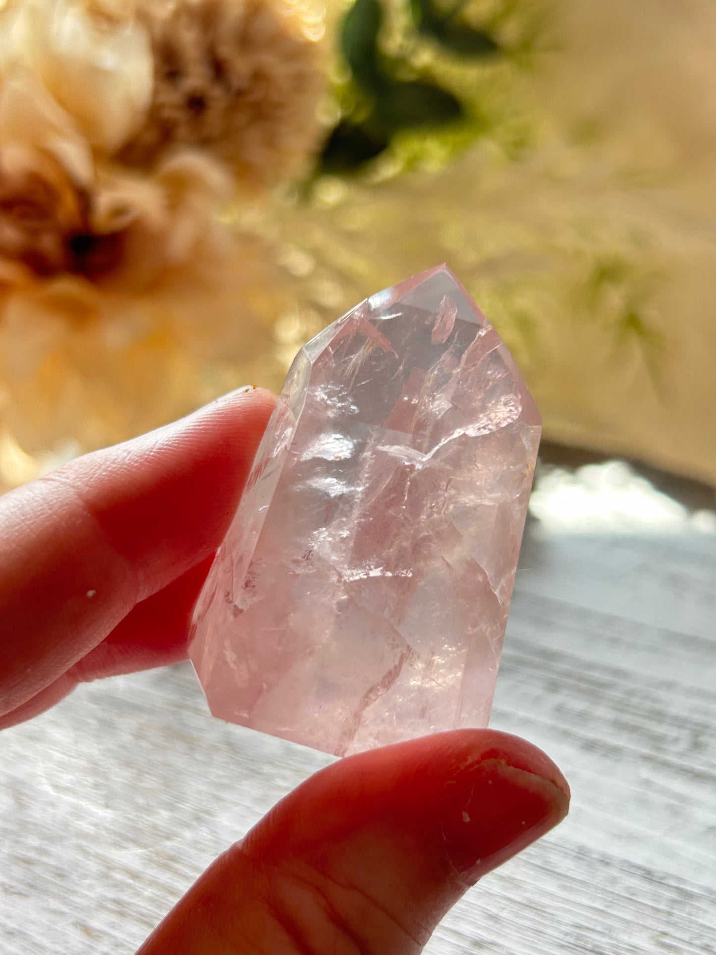 Beautiful polished Rose Quartz with calming blush tones, natural clarity, and glossy crystal finish.