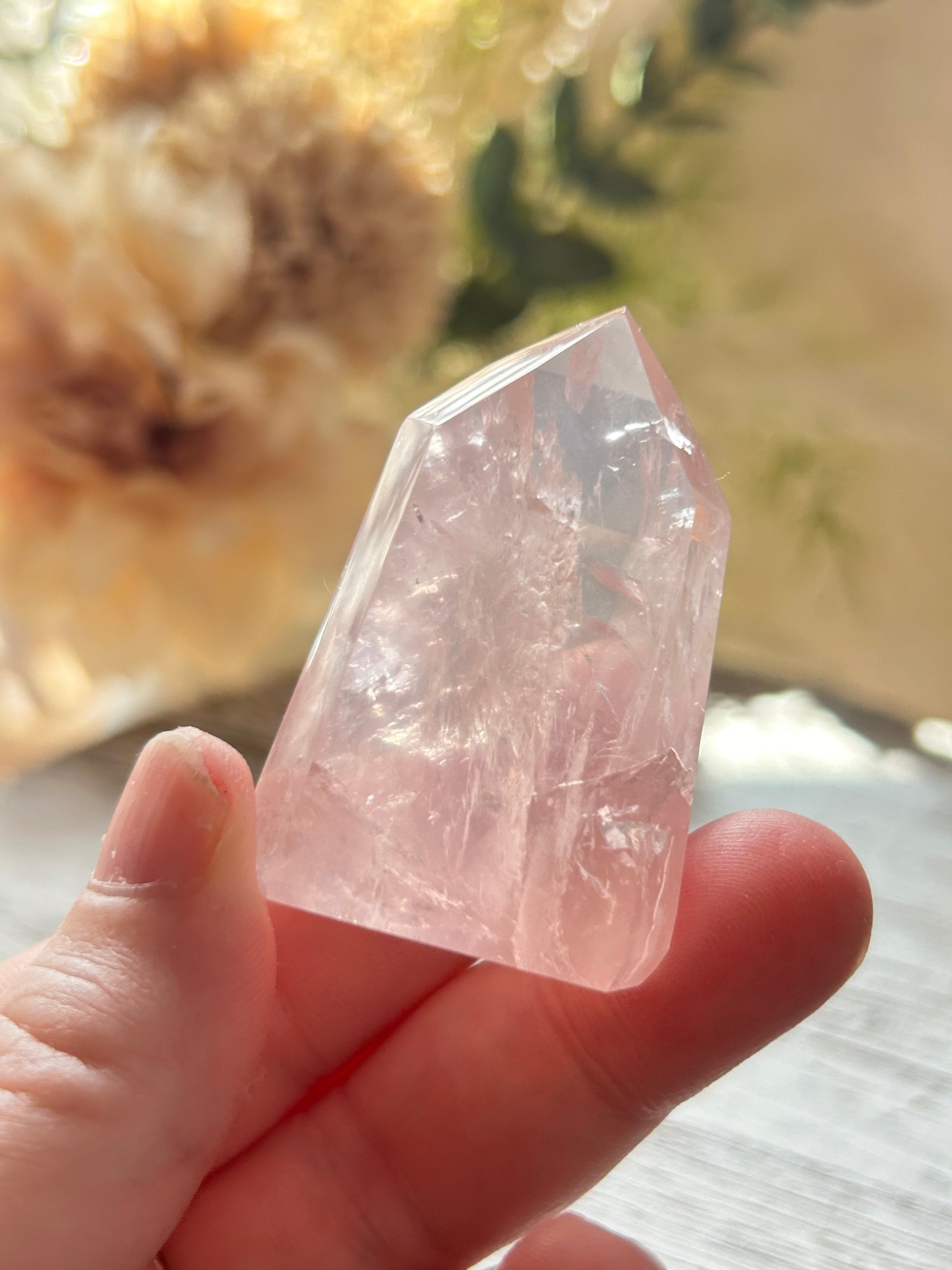 Beautiful polished Rose Quartz with calming blush tones, natural clarity, and glossy crystal finish.